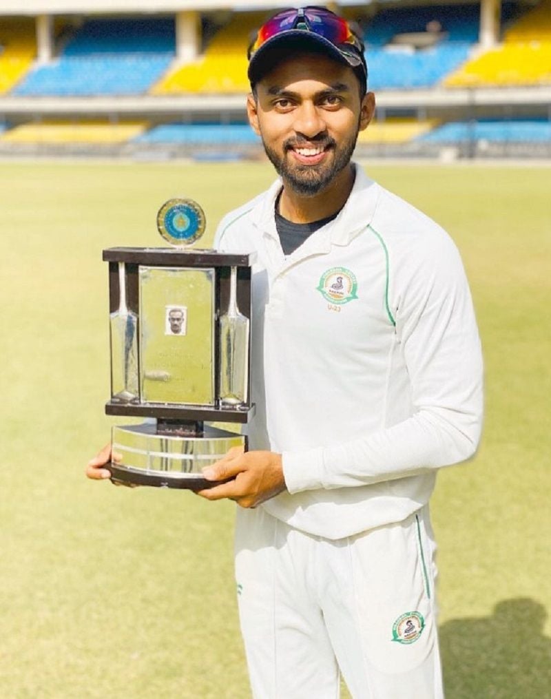 Atharva Taide holding the U23 Col. CK. Nayudu Trophy