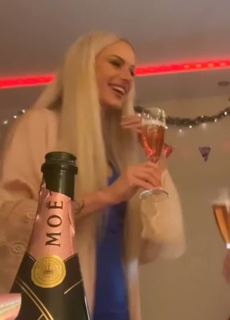 Aurélia Ziva with a glass of an alcoholic beverage