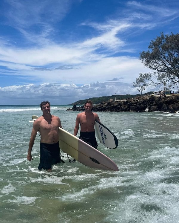 Austen Kroll (right), along with a friend, after surfing in Australia