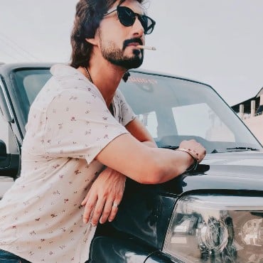 Avi Rakheja while smoking a cigarette