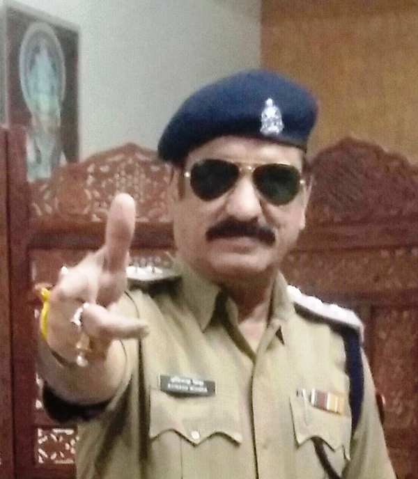 Avinash Mishra posing for a photo in uniform