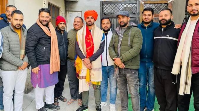 Avinash Singh celebrating his selection in RCB with his friends and family members