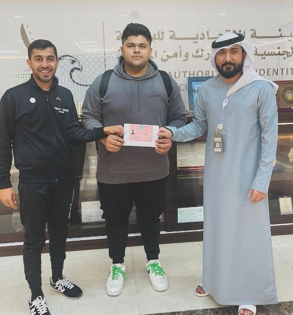 Azam Khan (centre) receiving Golden Visa