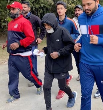 Azhar Ali posing with his father while running in a marathon
