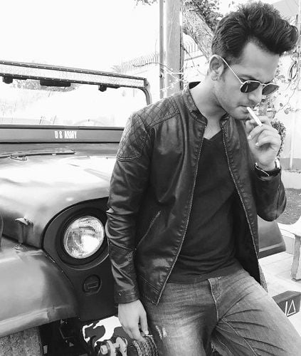 Azlan Shah smoking cigarette