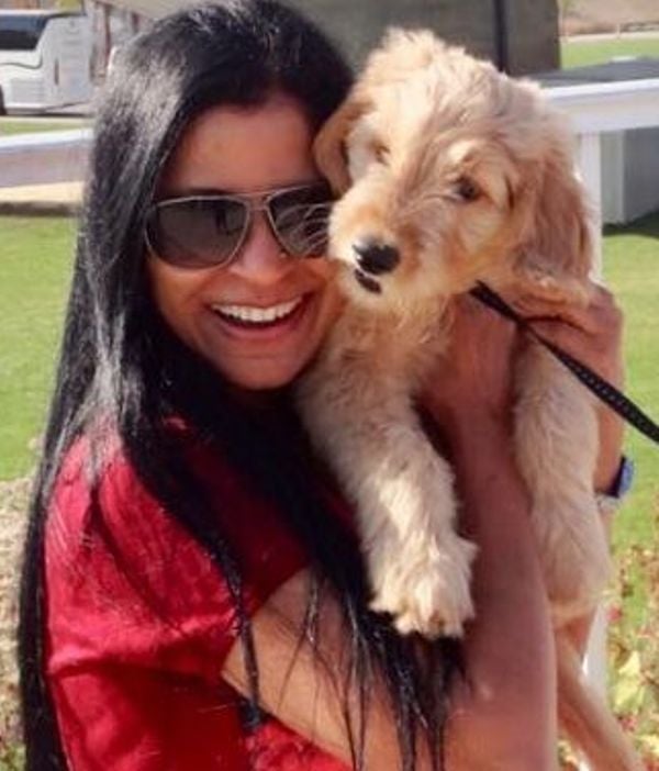 B. R. Chaya with her pet dog