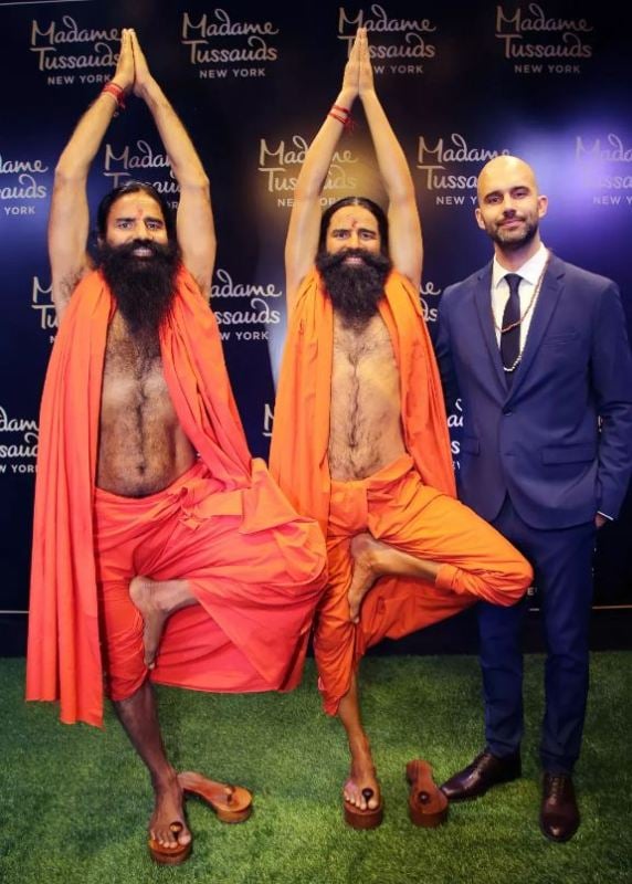 Baba Ramdev, along with the Marketing head of Madame Tussauds New York Tiago Mogadouro, with his wax statue