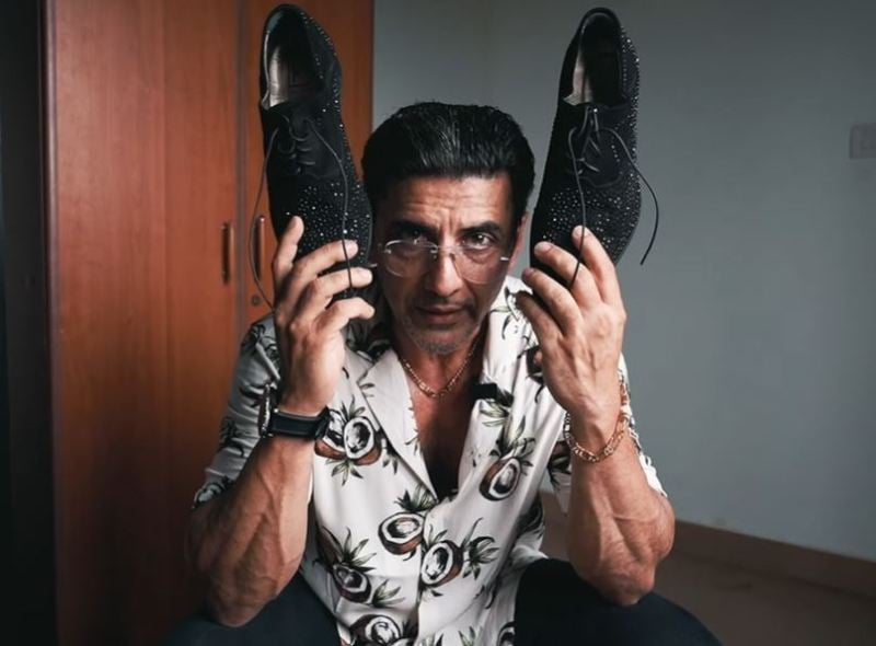 Babloo Prithiveeraj while holding black semi-precious stonned shoes, costing around Rs. 1,50,000, which he received as a birthday gift from one of his friends