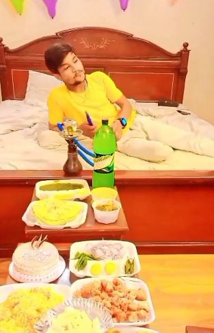 Babul Bihari smoking a hukkah