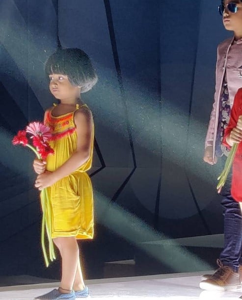 Baby Aazhiya while walking the ramp at a fashion show