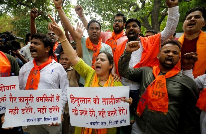 Activists of Bajrang Dal, a Hindu hardline group, shout slogans during a protest against the killing of Kanhaiya Lal in Udaipur, a day after two Muslim men posted a video claiming responsibility for slaying him, in New Delhi, India