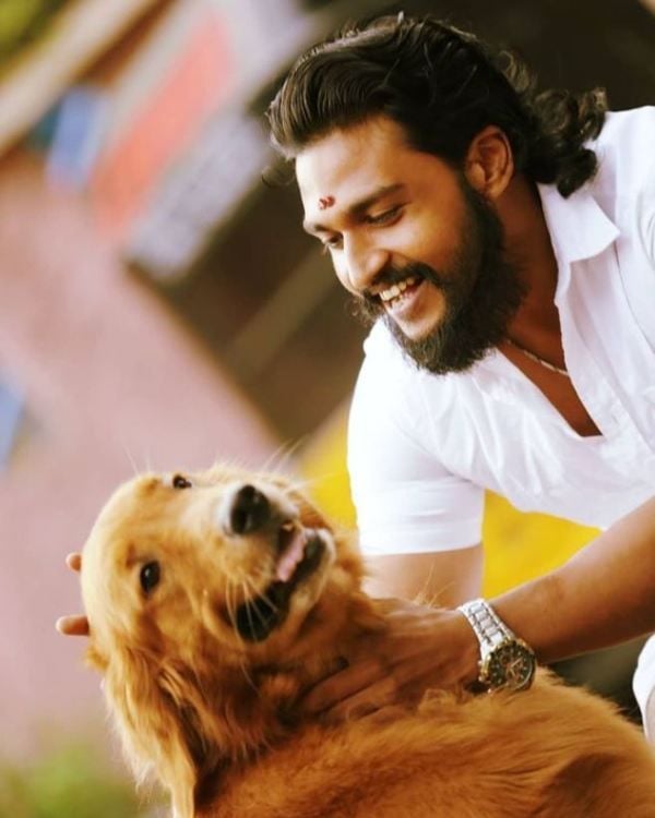 Bala Hasan cuddling with his pet dog