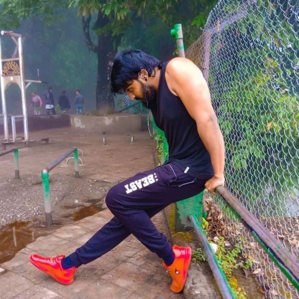 Bala Hasan showing his muscles