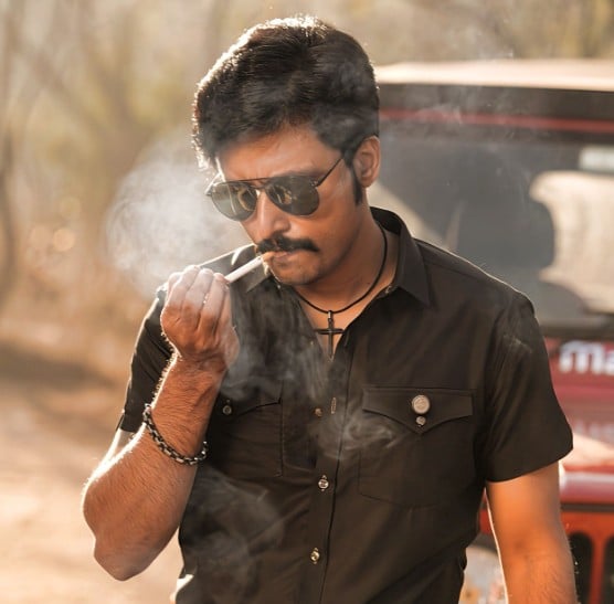 Bandi Saroj Kumar while smoking a cigarette