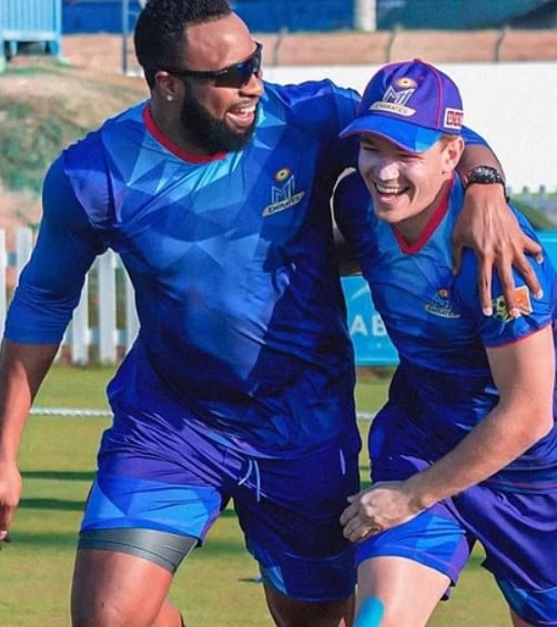 Bas De Leede while having fun with peer during the ILT20 competition for the MI Emirates team