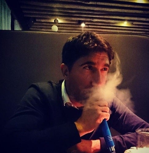 Bashar Rahal smoking a hukka