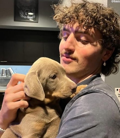 Benson Boone posing with his pet