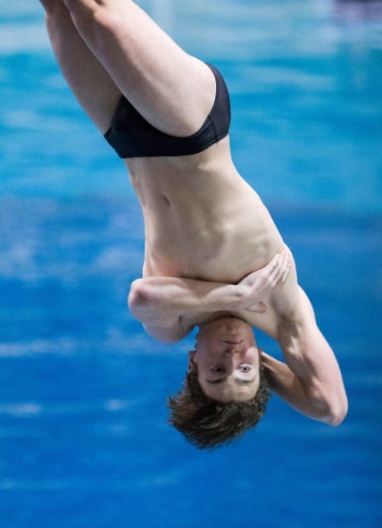 Benson Boone, then a Monroe High School student, twists during a 1-meter diving competition at the Washington 4A swimming championships in Federal Way in 2020