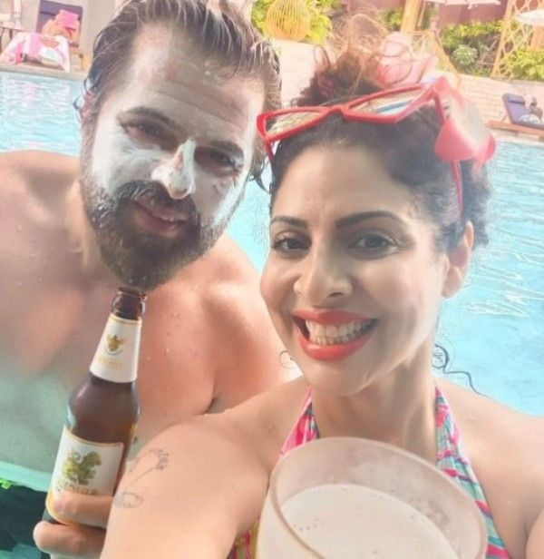 Bhakhtyar Irani holding a bottle of beer