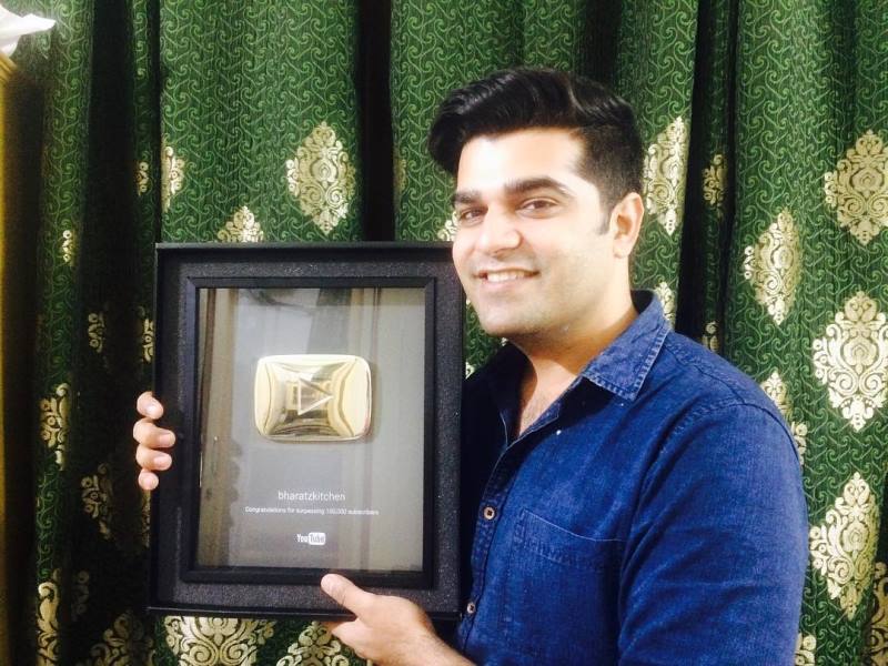Bharat Wadhwa posing with the golden YouTube play button
