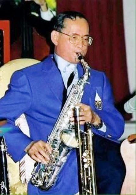 Bhumibol Adulyadej while playing a Saxophone