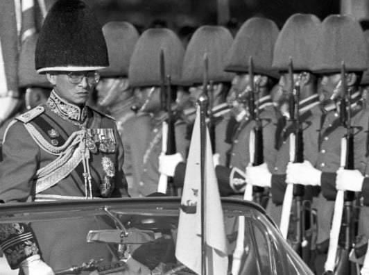 Bhumibol Adulyadej while examining Thai Military