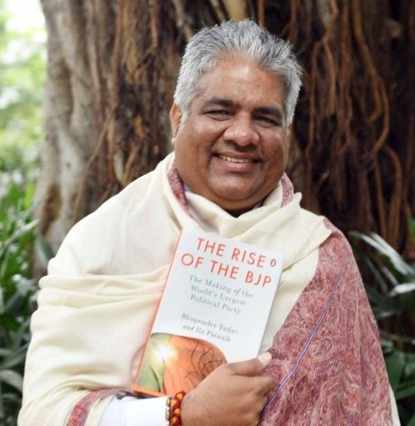 Bhupender Yadav holding his book, The Rise of the BJP The Making of the World