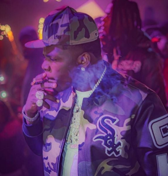 Big Boogie smoking a cigar during one of his live shows