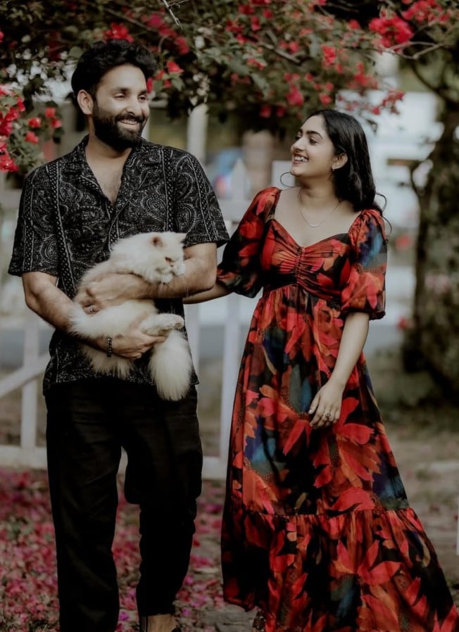 Binny Sebastian and her husband with their cat
