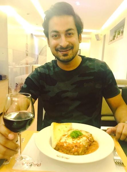 Bishwajit Ghosh enjoying an alcoholic drink