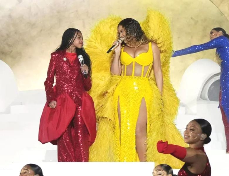 Blue Ivy Carter and Beyoncé while performing at an event in Dubai