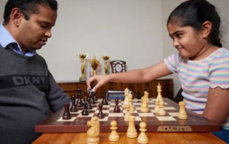 Bodhana Sivanandan, while playing chess with her father