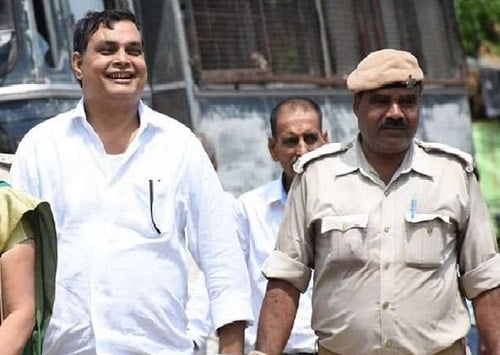 Brajesh Thakur smiling after being arrested in the shelter home rape case