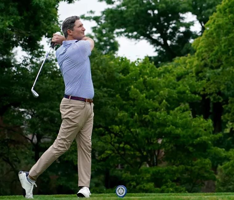 Brian Niccol playing golf