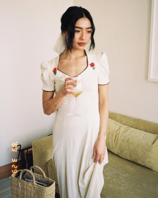 Brianne Tju with a glass of alcohol