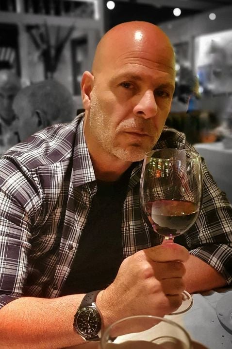 Bruce Willis drinking wine