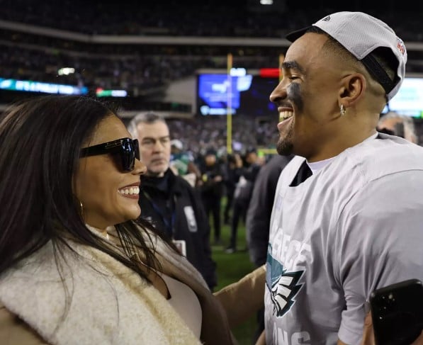 Bryonna Burrows and Jalen Hurts while celebrating on the football field after his team won the NFC Championship against the San Francisco 49ers