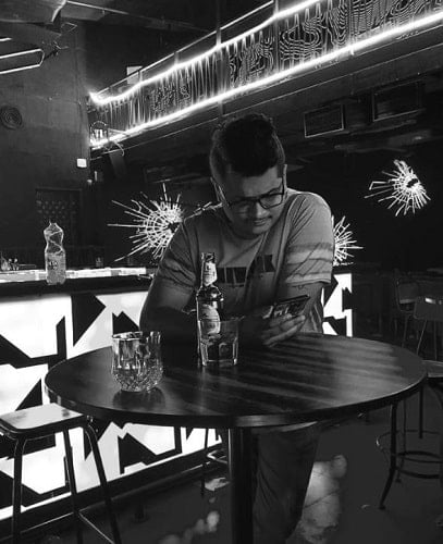 Chaitanya Master sitting at a bar