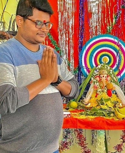Chaitanya Master with an idol of Lord Ganesha