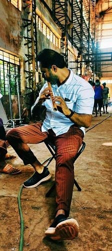 Chakravarthy Chandrachud playing the flute