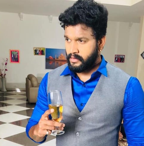 Chandrakanth enjoying an alcoholic beverage