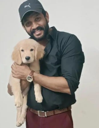 Chandrakanth posing with his pet dog