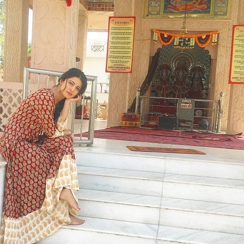 Charlie Chauhan in a temple