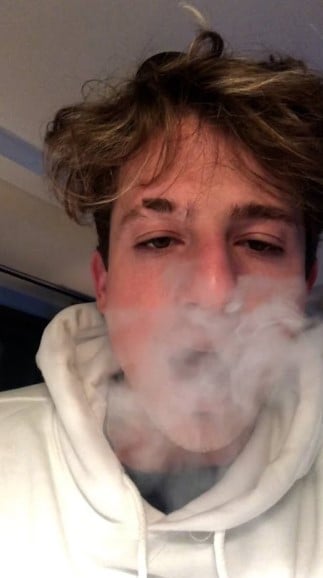 Charlie Puth while smoking a cigarette