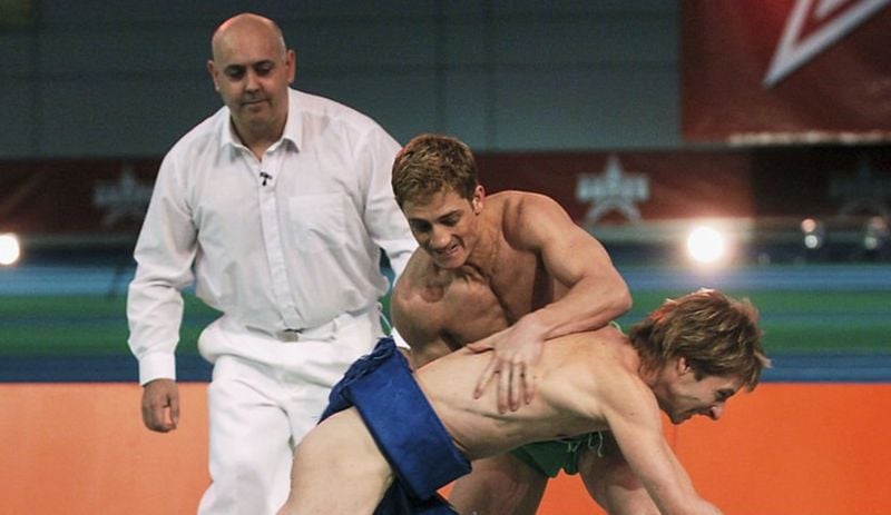 Chesney Hawkes (wearing blue) in a still from the British reality sports game show titled 