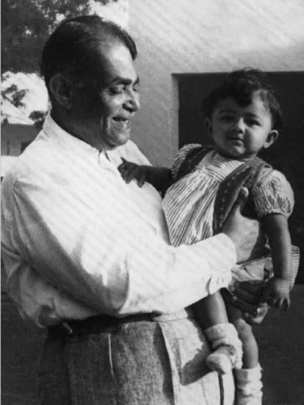 Childhood image of Leena Tewari with her grandfather