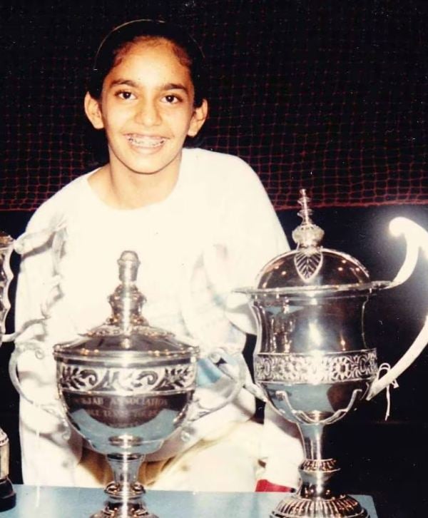 Chilhood photo of Aparna Popat with her achievements