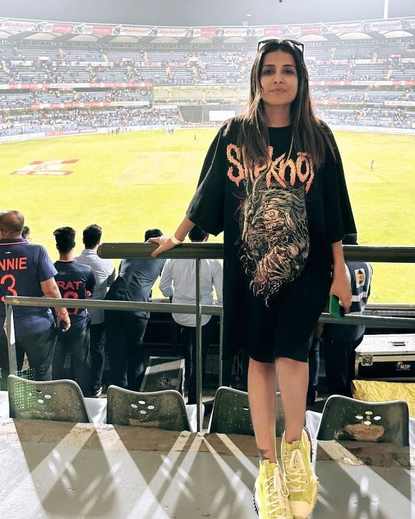 Chitralekha Sen posing in a cricket stadium