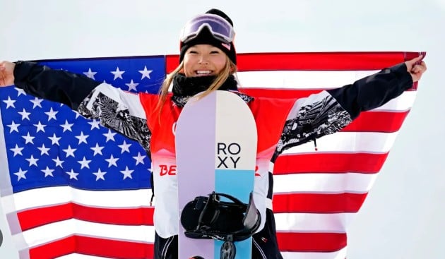 Chloe Kim while carrying the flag for Team USA during the Opening Ceremony of the Winter Youth Olympic Games