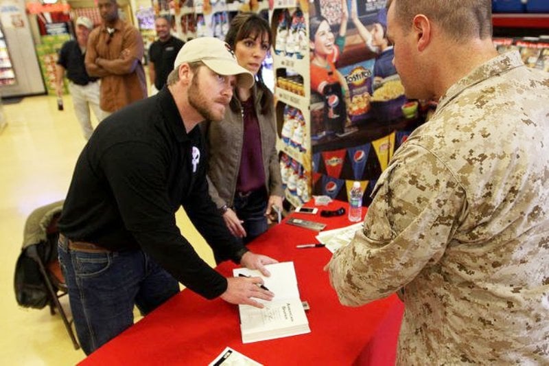 Chris Kyle signing his book during the book